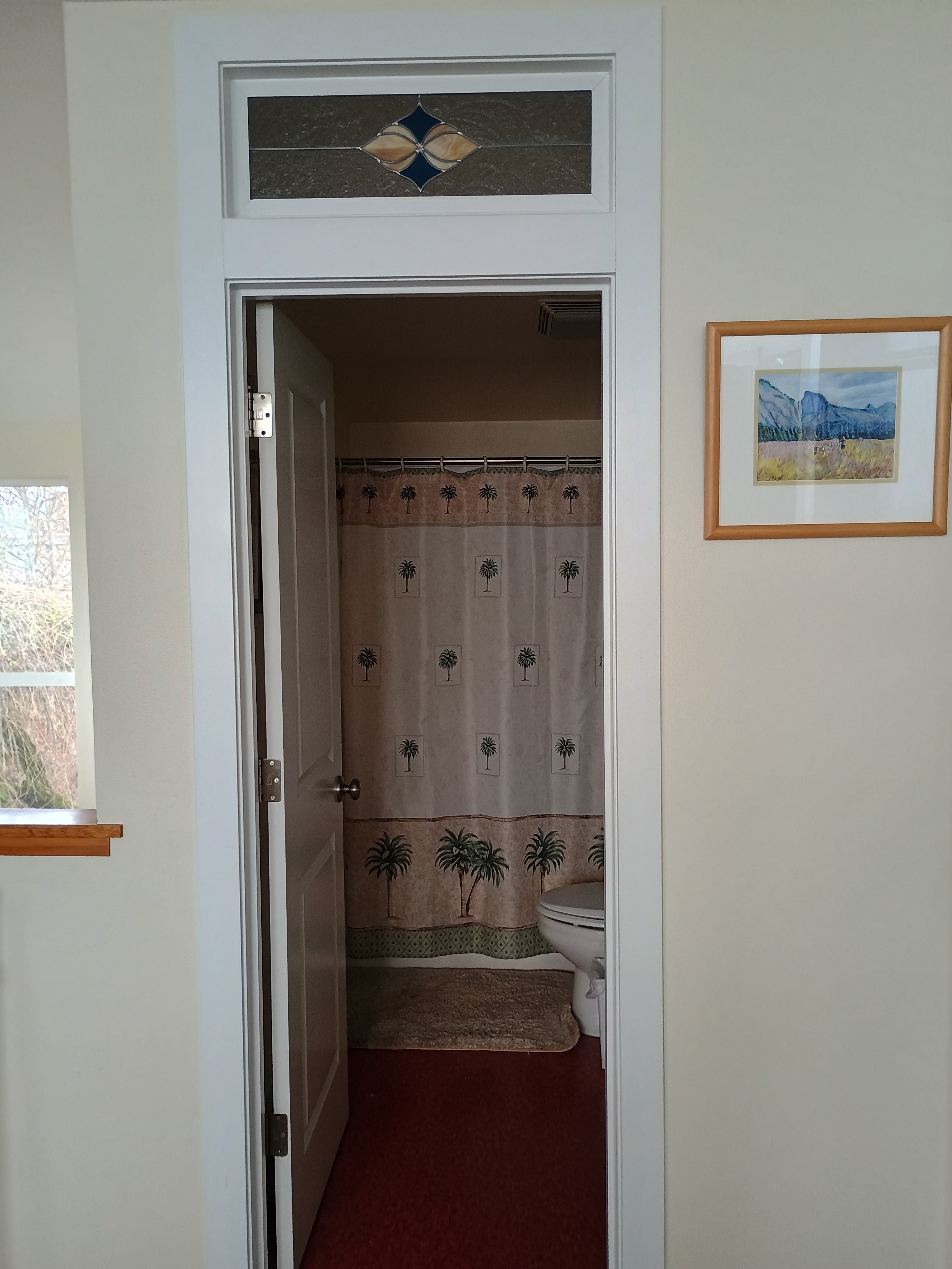 Bathroom framed by decorative elements.